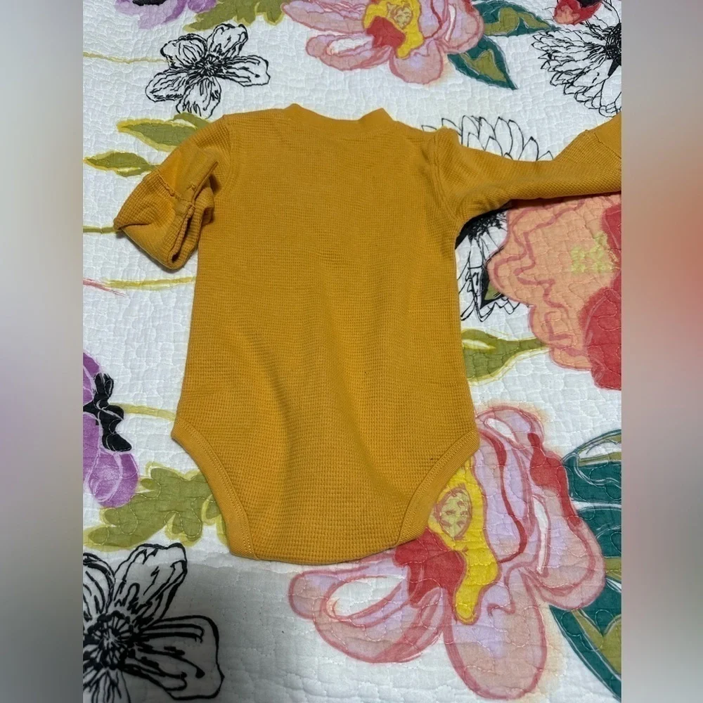 Brand new gold waffle knit onesie. Size 12 months.